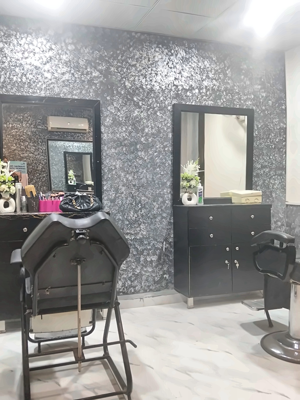 Inside Raheelas Beauty Studio — elegant reception with marble finish